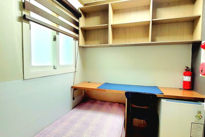 Unit 407: Studio-style room with an exterior  1th image
