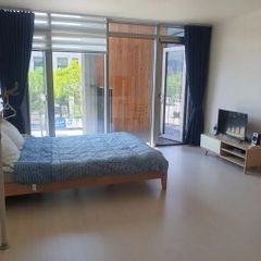 A glass-walled room with a terrace Unit Image