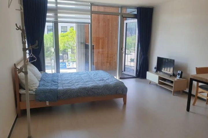 A glass-walled room with a terrace 0th image