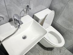 Clean, modern white studio apartment 2th image