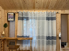 A room with a pretty garden in the forest. 7th image