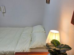 A cozy room with plenty of sunshine. 5th image