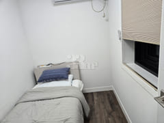 3rd-floor unit facing a park with a forest vi 9th image