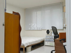 A low-rise apartment building in a quiet, pea 5th image