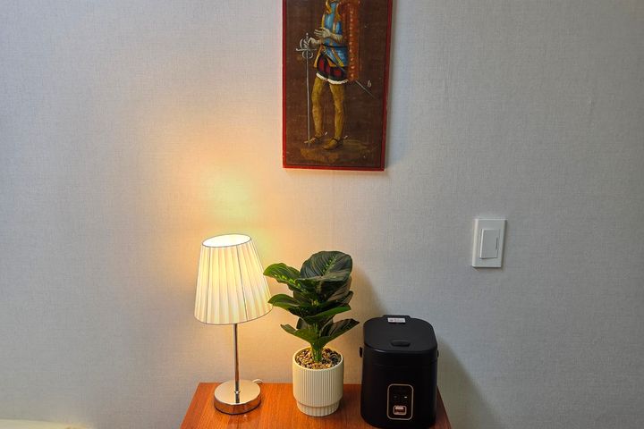 A cozy room with plenty of sunshine. 6th image