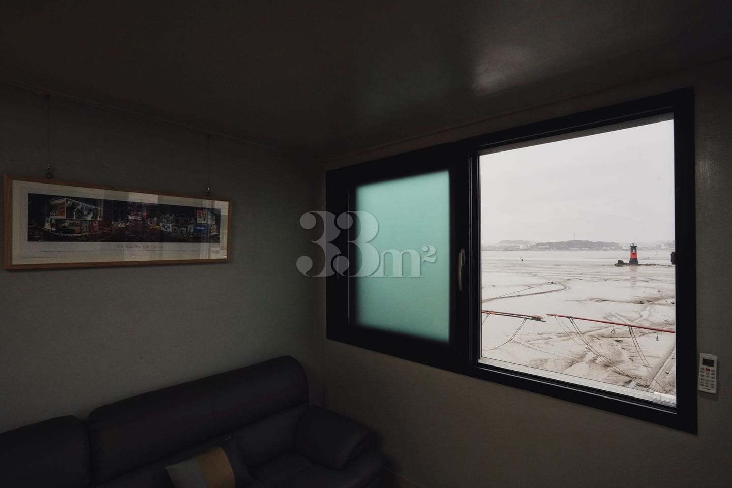 A house with a view of the sea and a lighthou 7th image