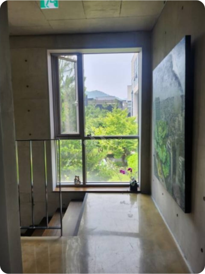 A room with a beautiful view and floor-to-cei 10th image