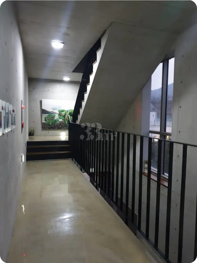 A room with a beautiful view and floor-to-cei 7th image