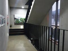 A room with a beautiful view and floor-to-cei 7th image