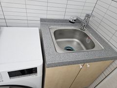 Clean white and gray studio apartment 11th image