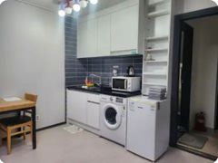 A glass-walled room with a terrace 4th image