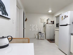 A low-rise apartment building in a quiet, pea 1th image