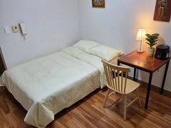 A cozy room with plenty of sunshine. 1th image