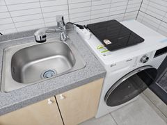 Clean, modern white studio apartment 10th image