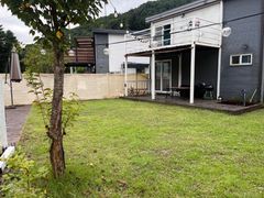 A stylish detached house in front of a valley 4th image
