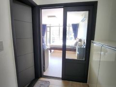 A room with a beautiful view and floor-to-cei 13th image