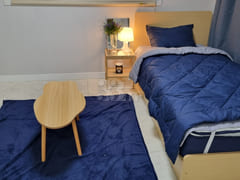 It is a neat, newly built room. 1th image