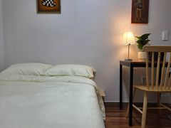 A cozy room with plenty of sunshine. 9th image