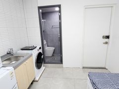 Clean, modern white studio apartment 1th image