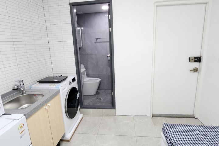 Clean, modern white studio apartment 1th image