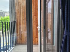A glass-walled room with a terrace 16th image
