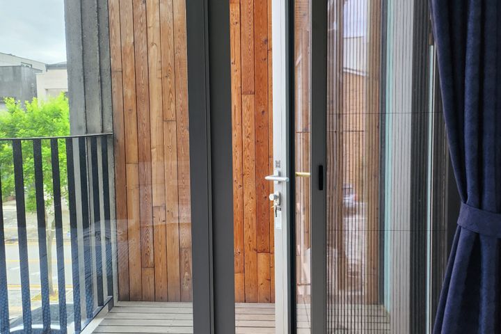 A glass-walled room with a terrace 16th image