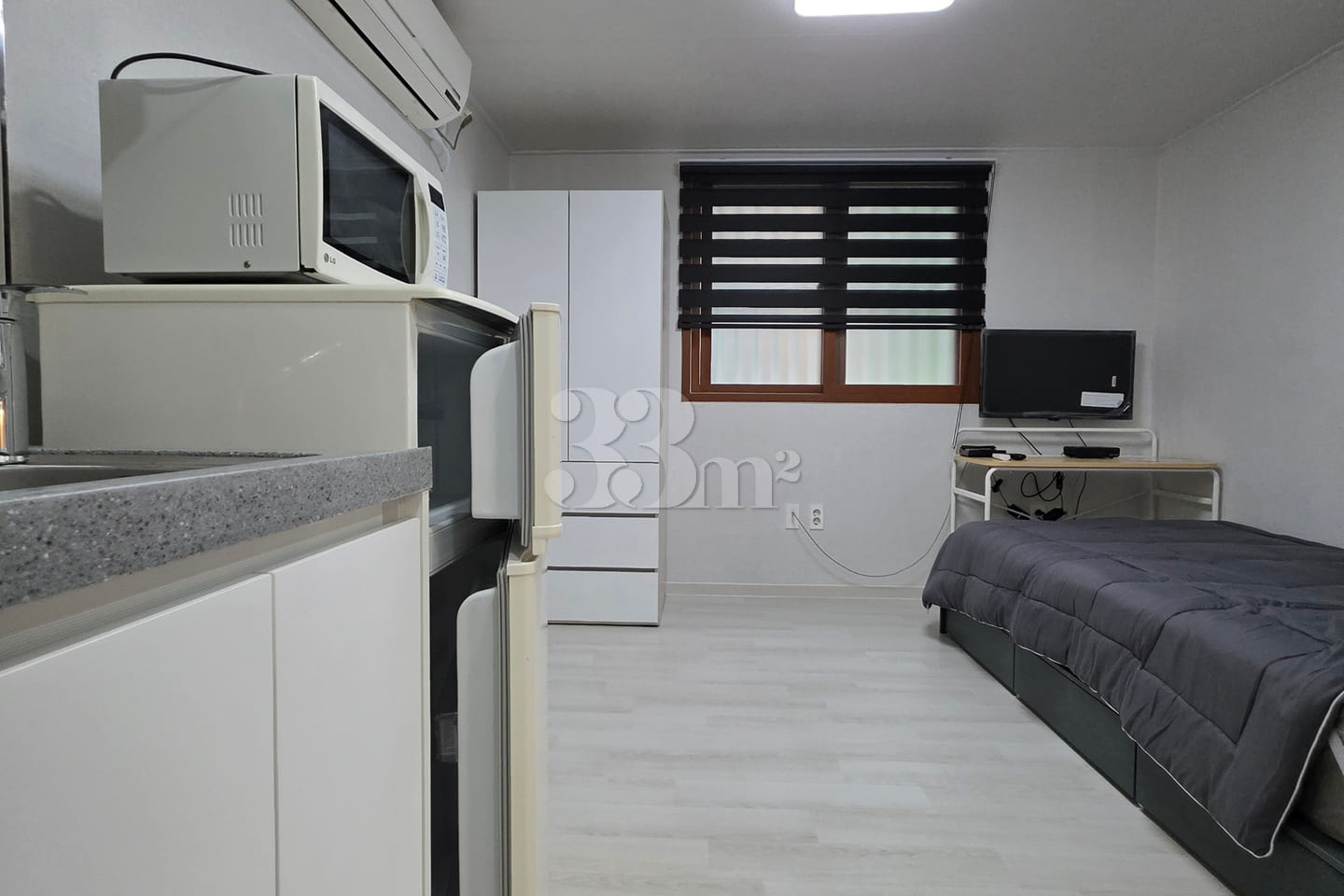 It is a neat studio apartment. 1th image