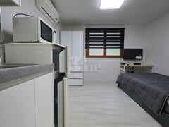 It is a neat studio apartment. 1th image