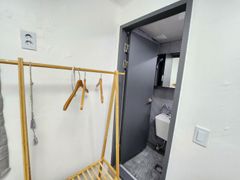 Clean white and gray studio apartment 7th image